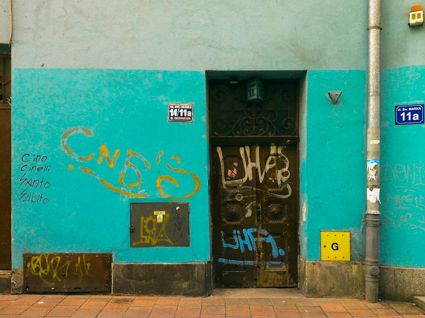 Street art on turquoise wall